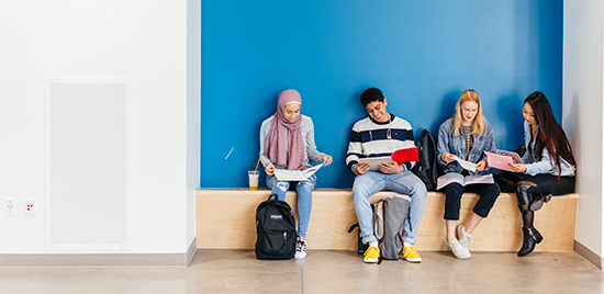 Four students sitting together in UC Irvine's Anteater Anteater Learning Pavilion