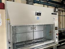 A metal exhausted enclosure in a lab.