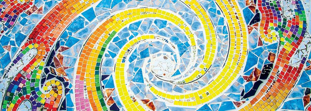 rainbow swirl comprised of mosaic tiles of various colors